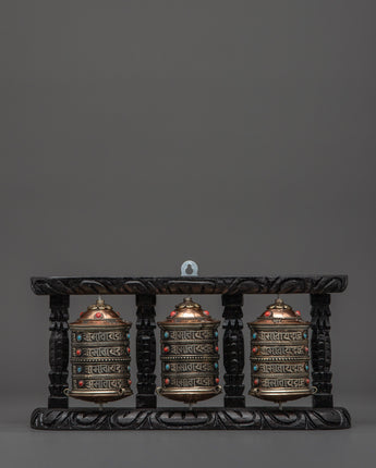 three-wheel-prayer-spinner-in-wooden-frame