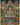 The image is a vibrant and colorful depiction of Buddhist deities, including Buddha, surrounded by various other figures and symbols. The overall composition is intricate and detailed, showcasing the rich cultural heritage and artistic style of the Buddhist art form.