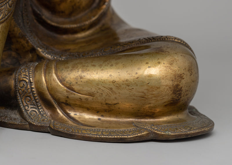 Buddha Statue with Head Resting on Knee