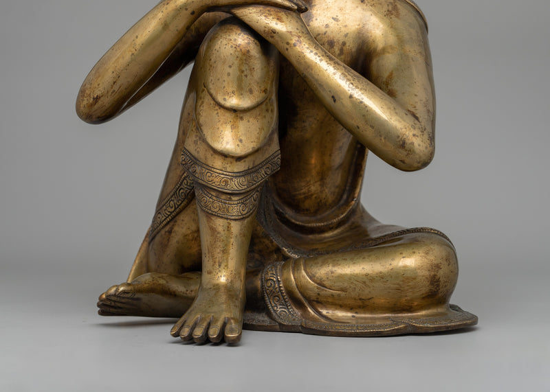 Buddha Statue with Head Resting on Knee