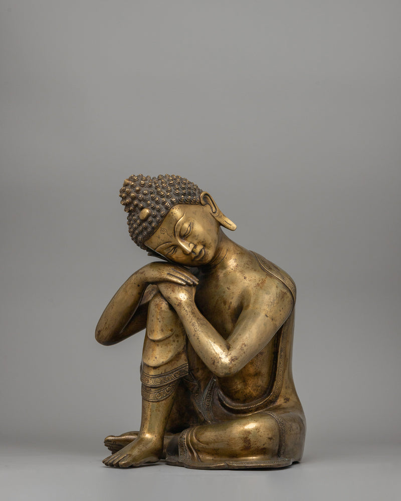 Buddha Statue with Head Resting on Knee