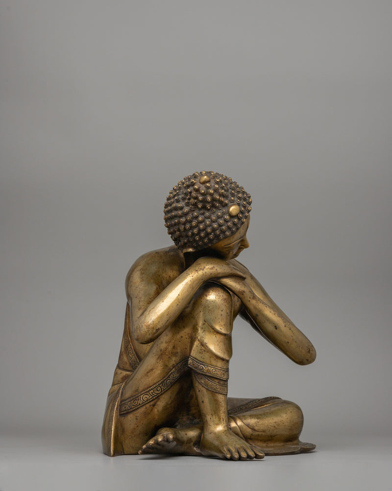 Buddha Statue with Head Resting on Knee