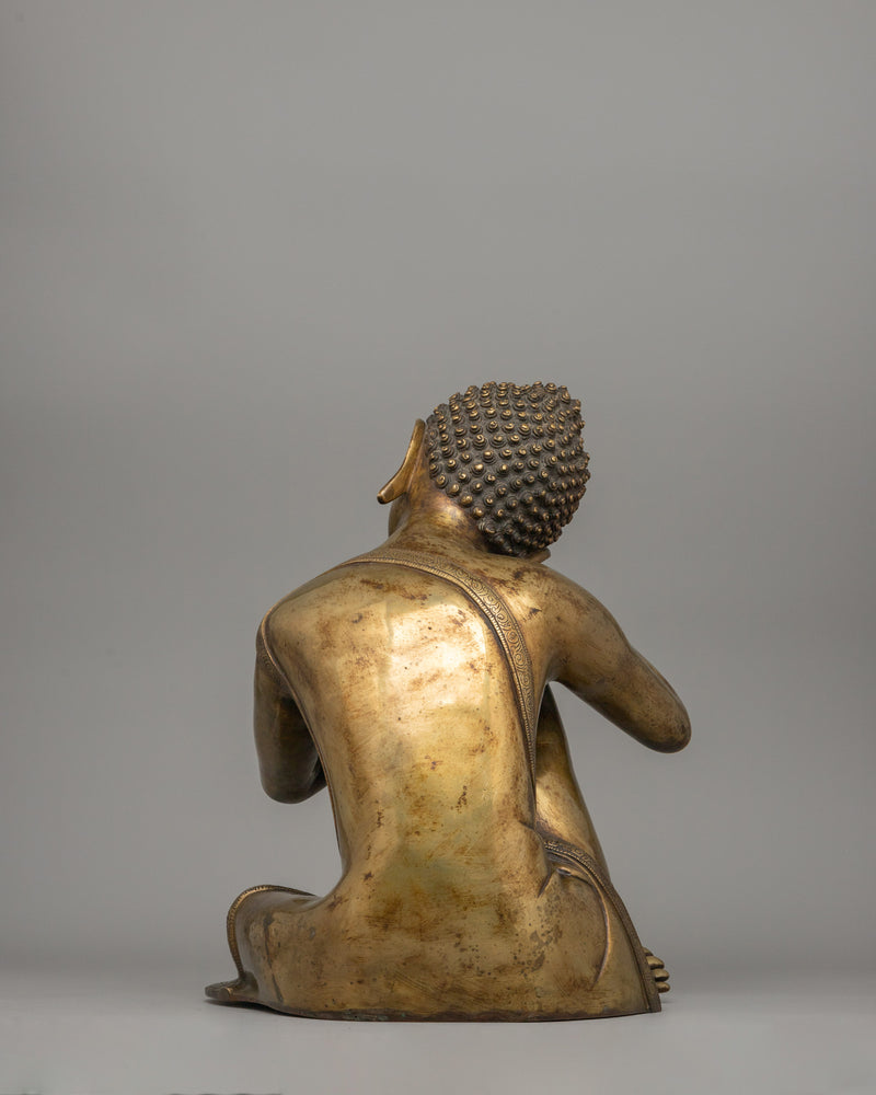 Buddha Statue with Head Resting on Knee