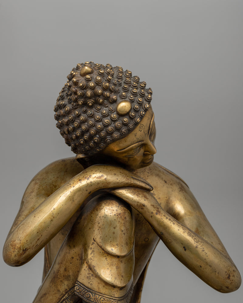 Buddha Statue with Head Resting on Knee