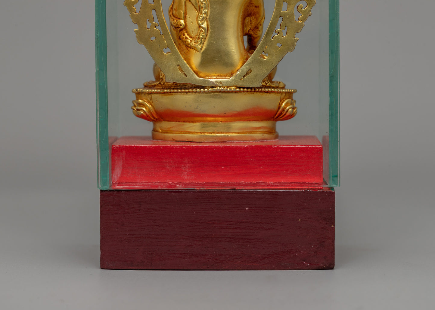 Glass-Enclosed Shakyamuni Buddha Statue | Meditative Lotus Pedestal Figure