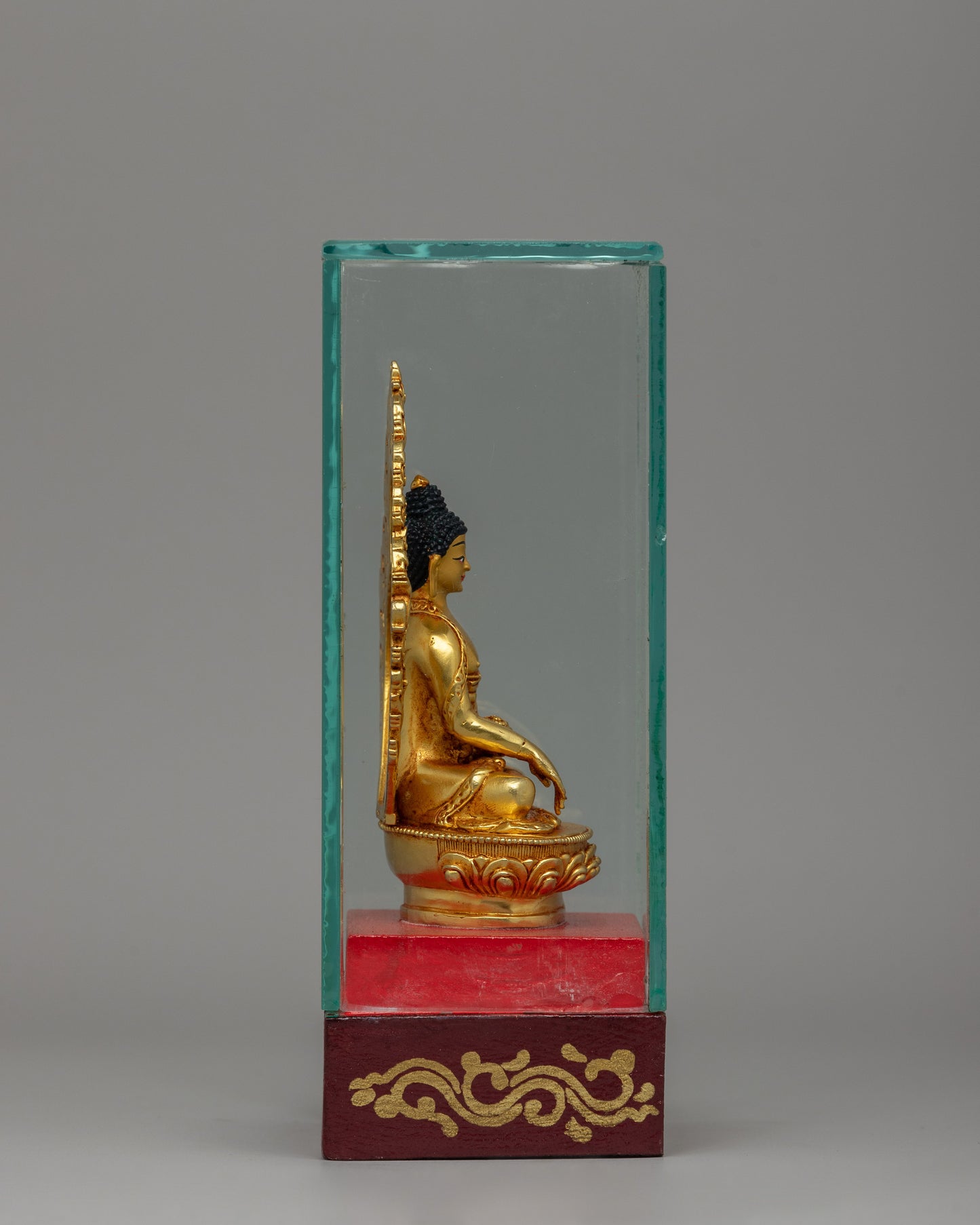 Glass-Enclosed Shakyamuni Buddha Statue | Meditative Lotus Pedestal Figure