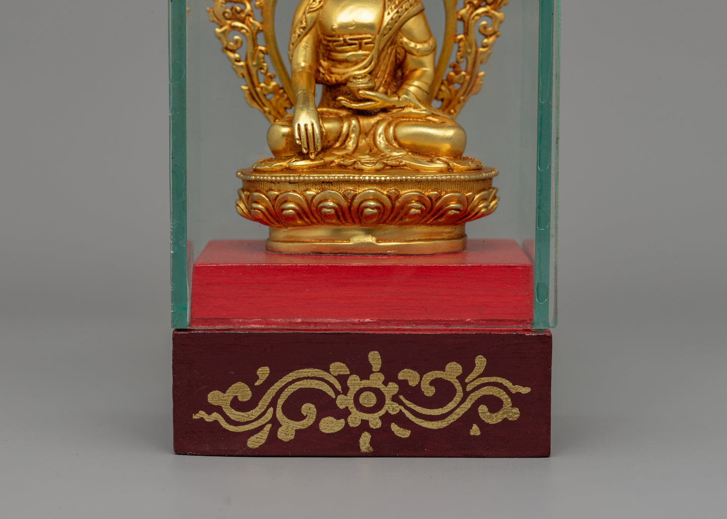 Glass-Enclosed Shakyamuni Buddha Statue | Meditative Lotus Pedestal Figure