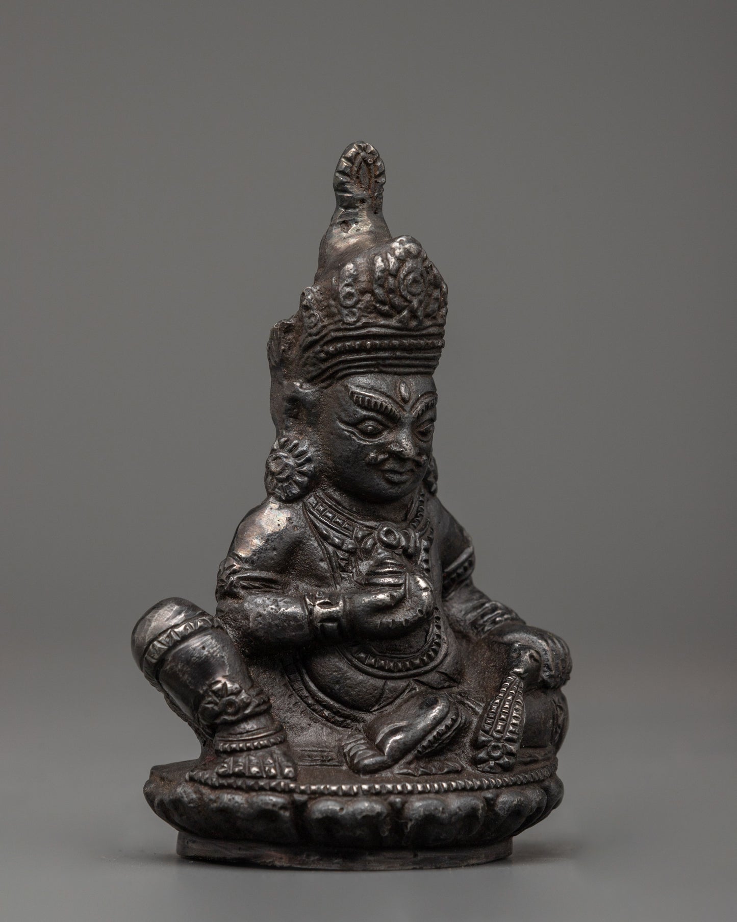 Iron Dzambhala Wealth Deity Figurine | Symbol of Abundance