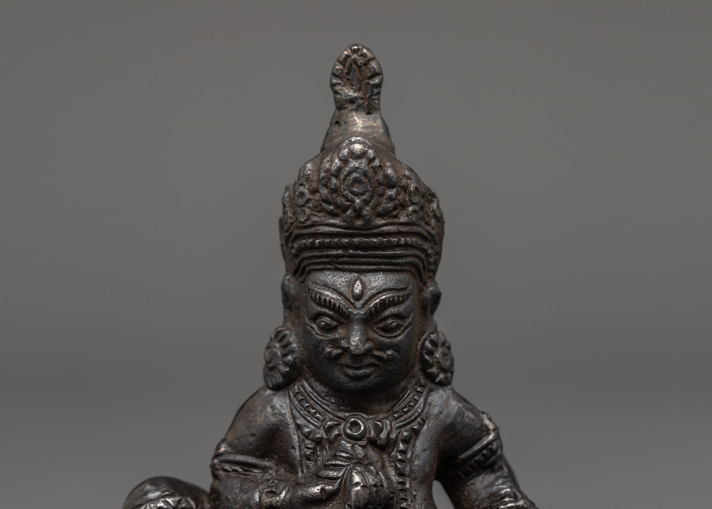 Iron Dzambhala Wealth Deity Figurine | Symbol of Abundance