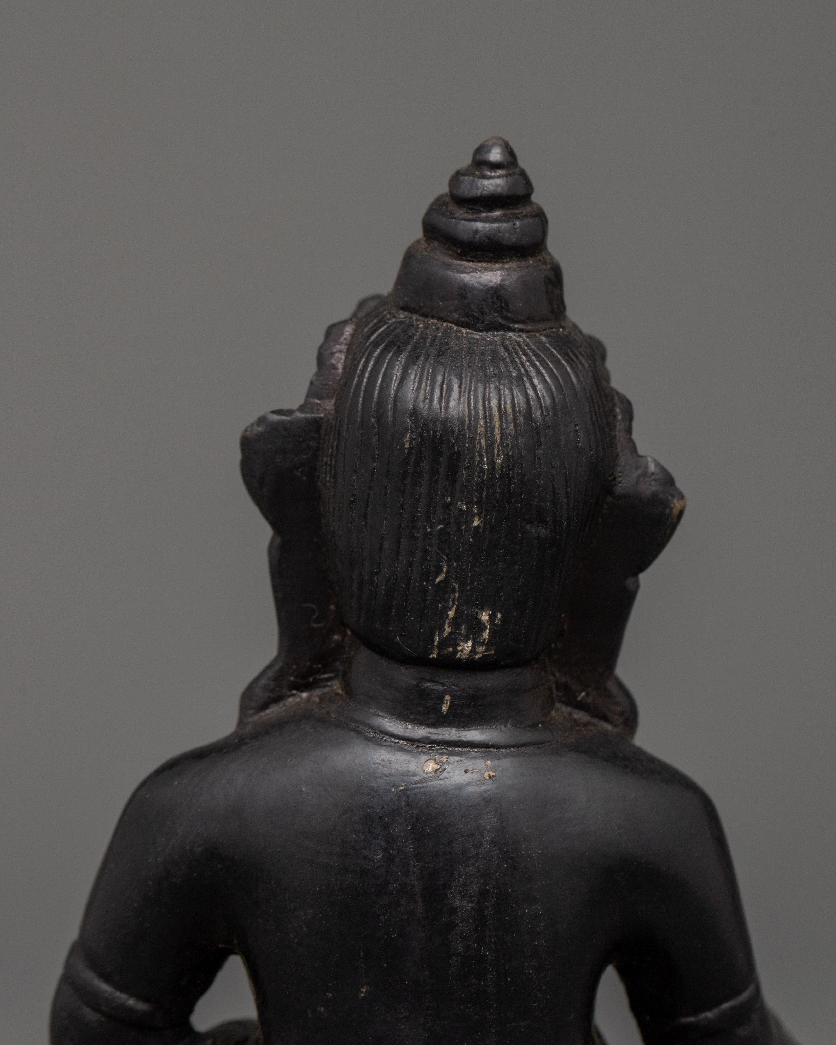 Dzambhala Oxidized Stone Statue | A Symbol of Wealth