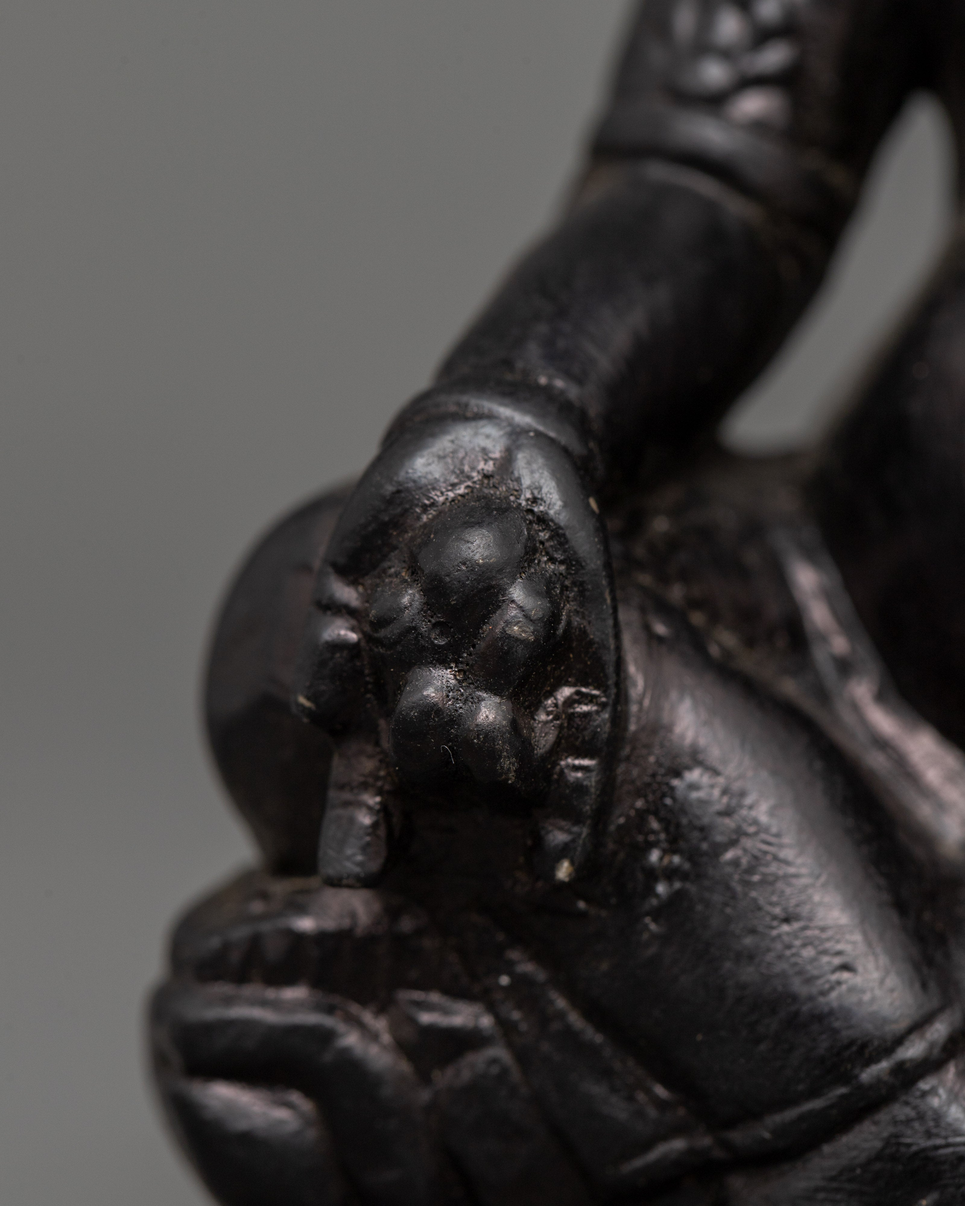 Dzambhala Oxidized Stone Statue | A Symbol of Wealth