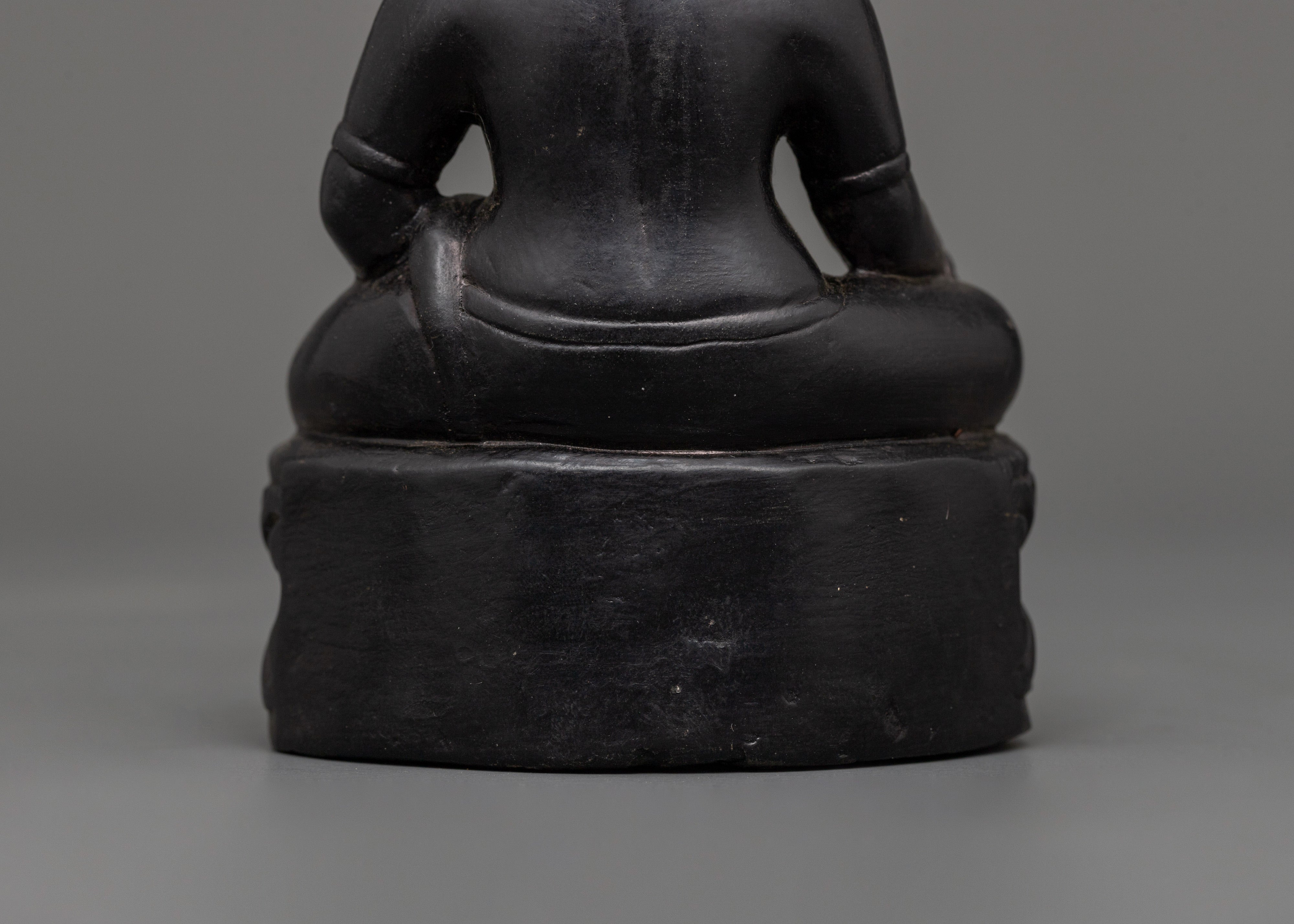 Dzambhala Oxidized Stone Statue | A Symbol of Wealth