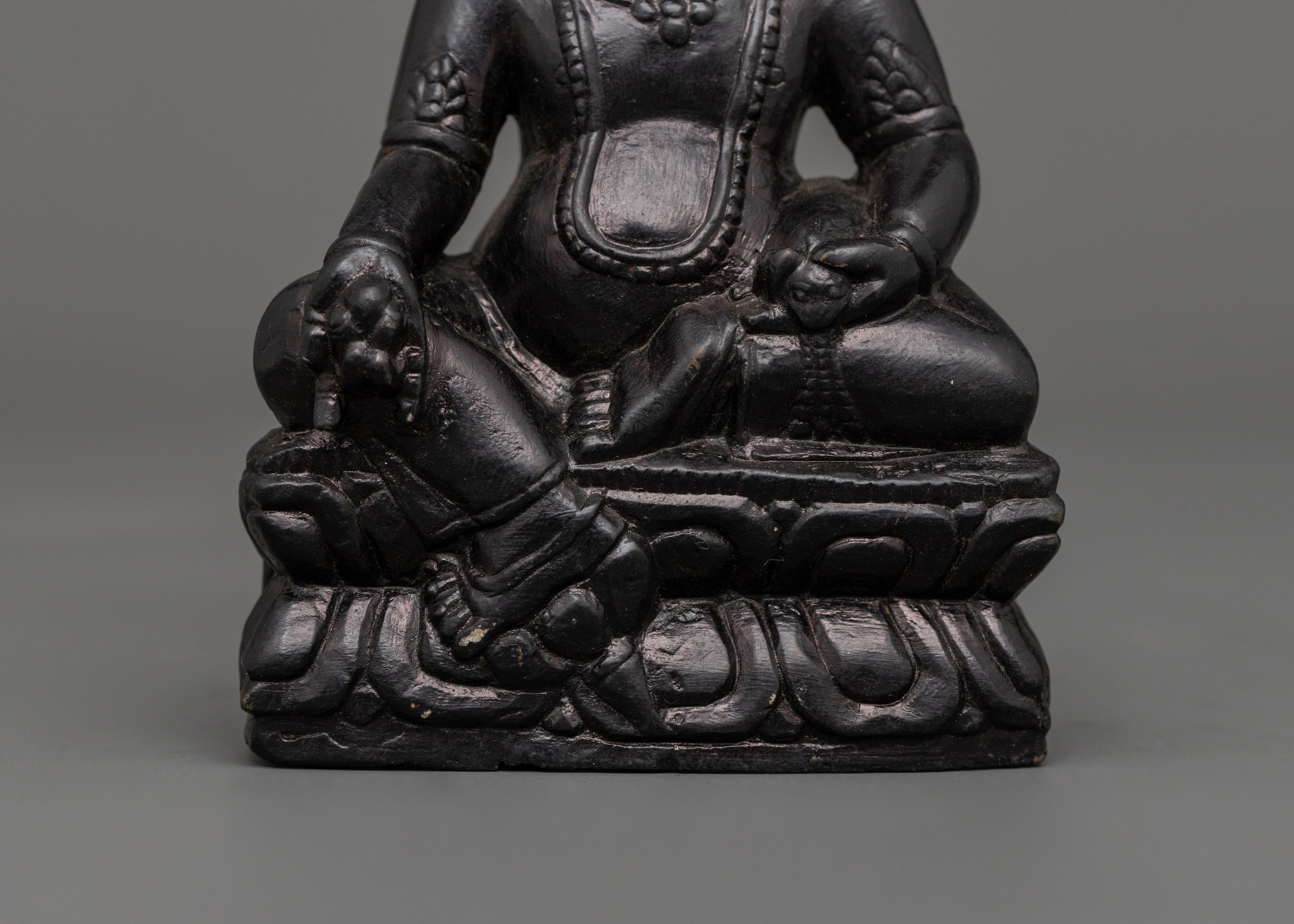 Dzambhala Oxidized Stone Statue | A Symbol of Wealth