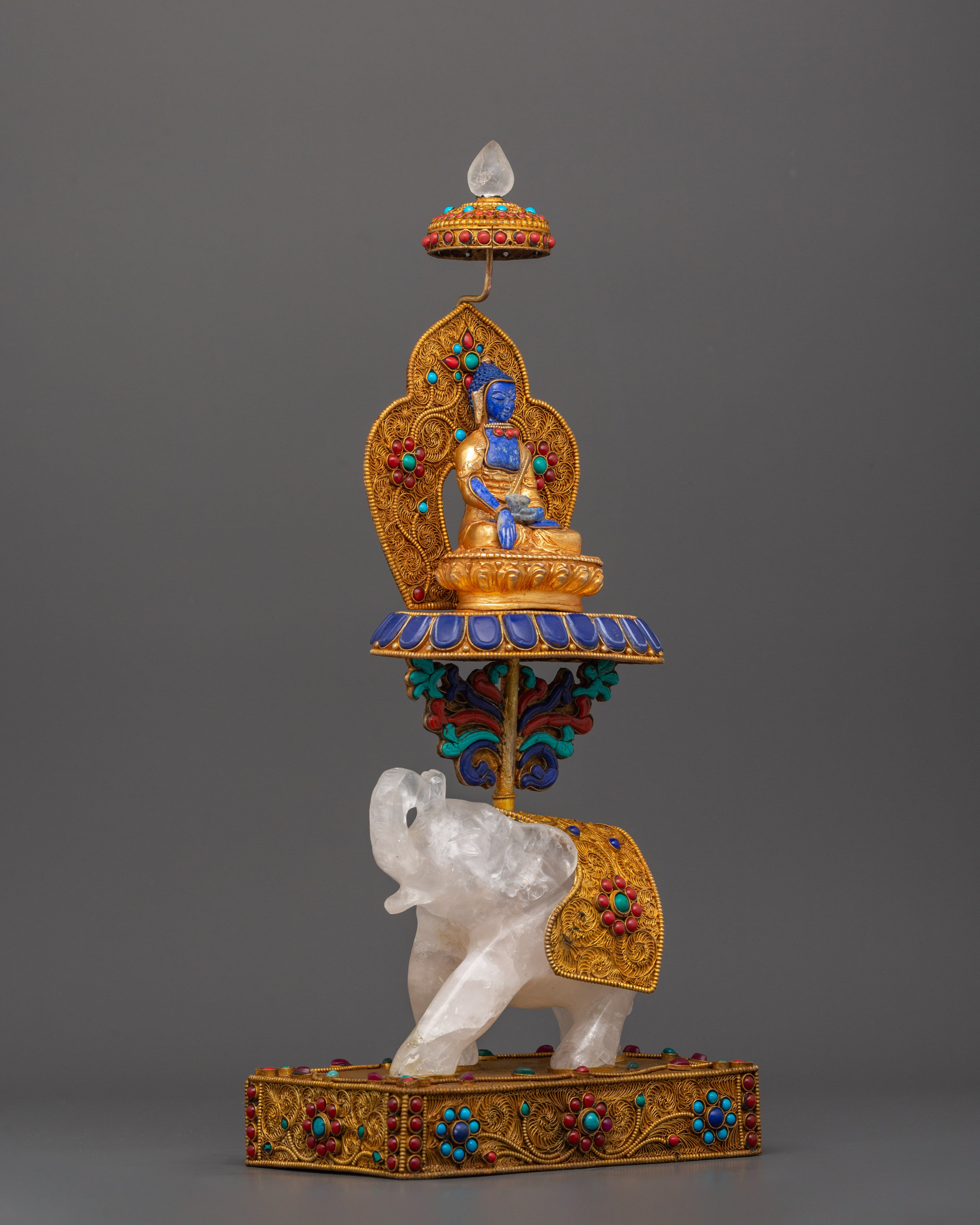 Shakyamuni Buddha on Crystal Elephant | Lapis & Coral Inlaid Gold Statue