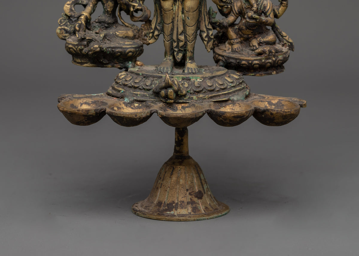 Brass Oil Lamp - Decorated with Avalokiteshvara, Vasudhara & Ganesh