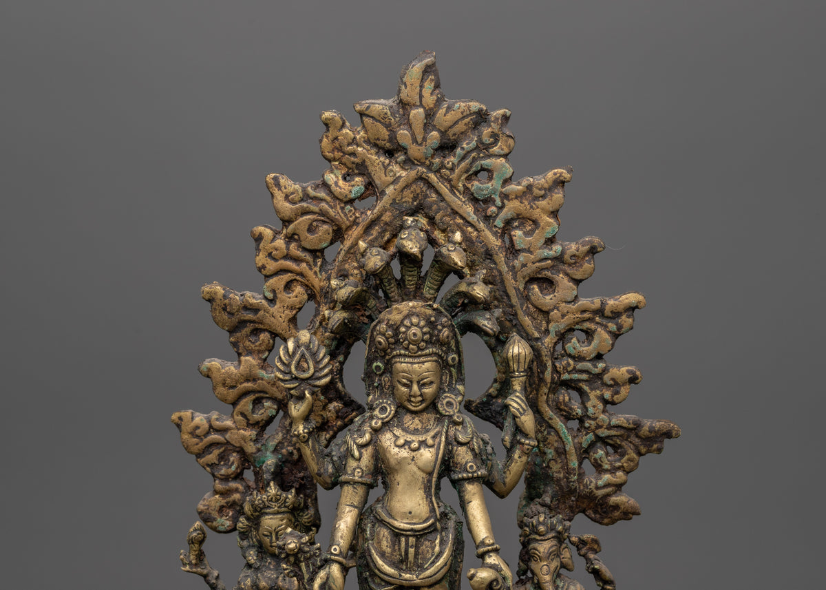 Brass Oil Lamp - Decorated with Avalokiteshvara, Vasudhara & Ganesh