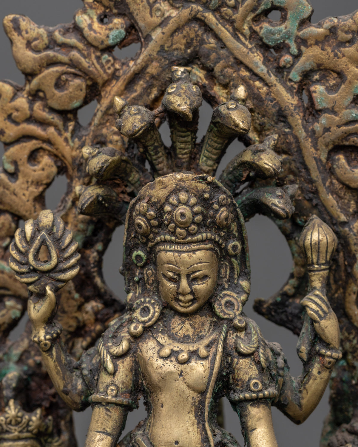 Brass Oil Lamp - Decorated with Avalokiteshvara, Vasudhara & Ganesh