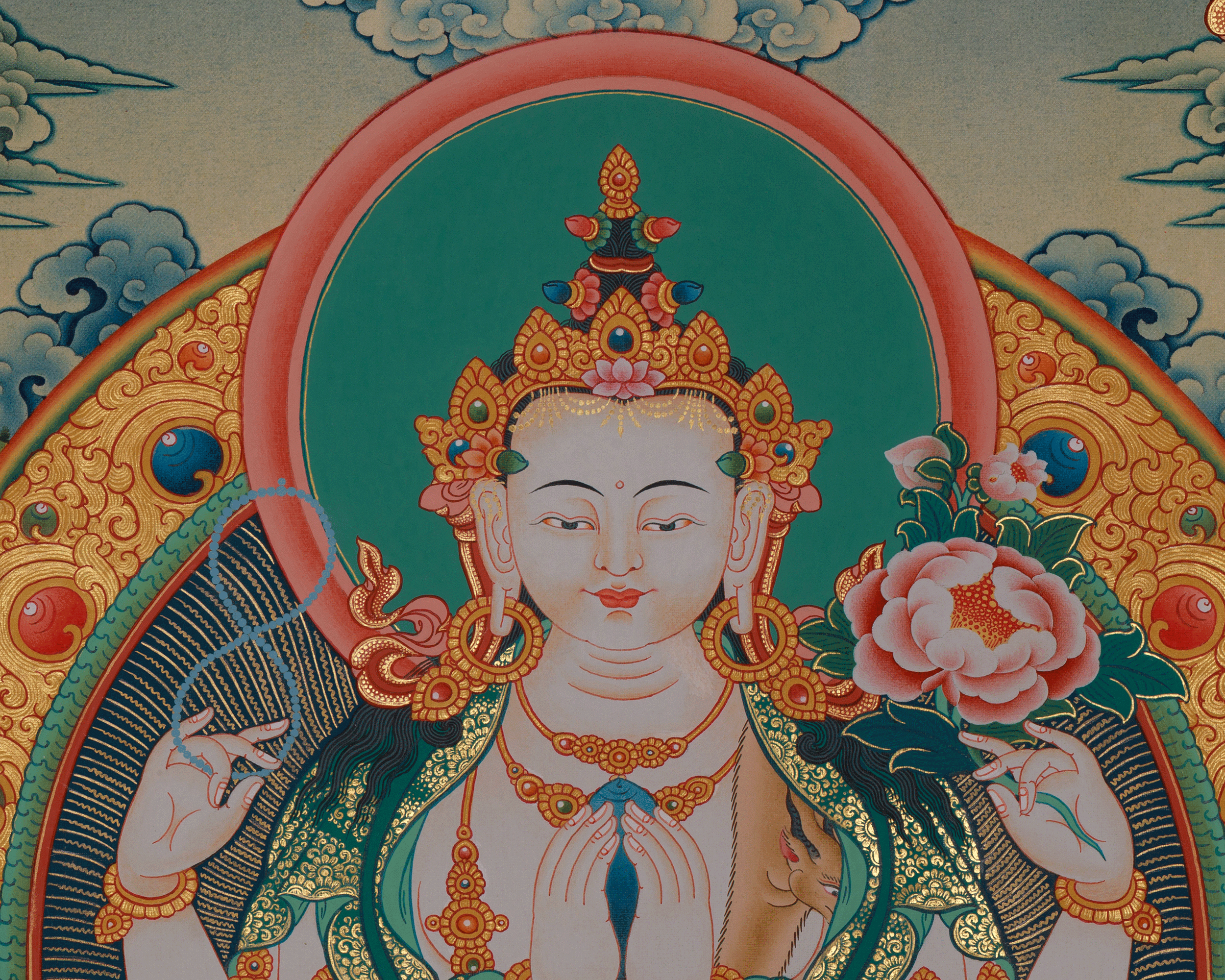 a colorful and ornate Buddhist deity, with intricate patterns and designs surrounding the central figure.