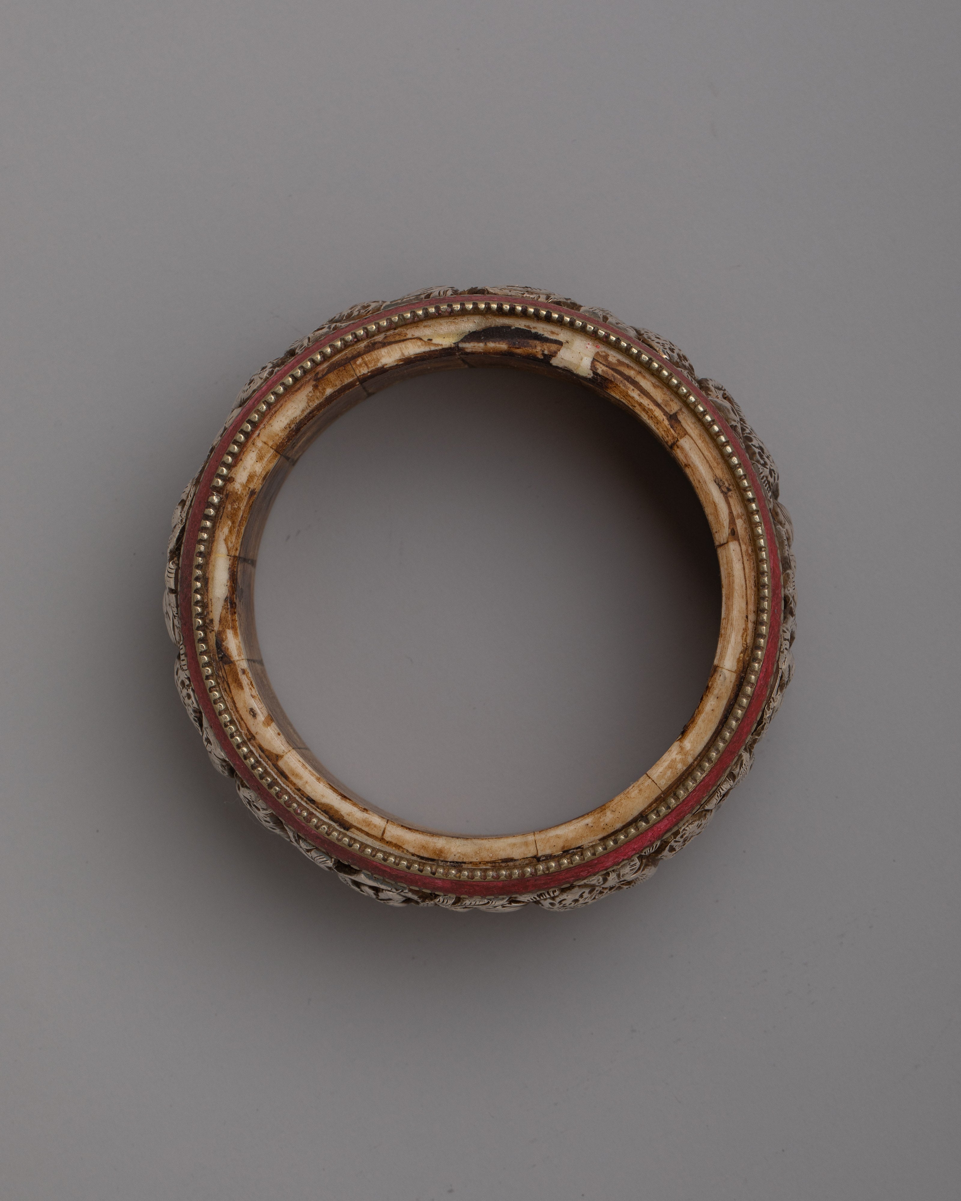 Tibetan Stone Border Bangle |  Intricately Carved Silver Design with Traditional Stone Accents