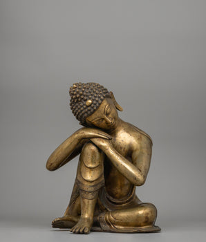 Buddha Statue with Head Resting on Knee