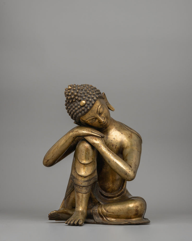 Buddha Statue with Head Resting on Knee