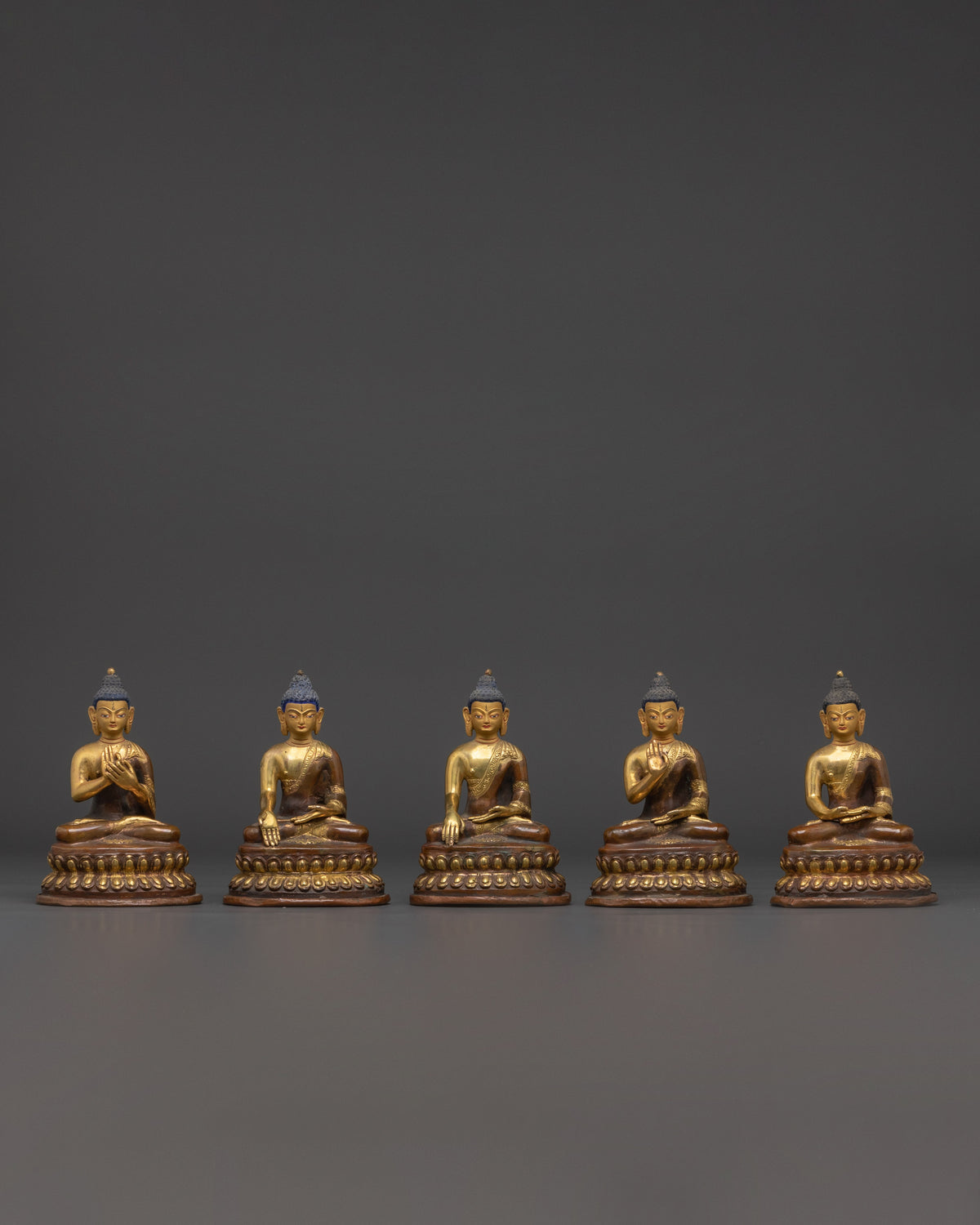 Set of Five Brass Buddha Statues