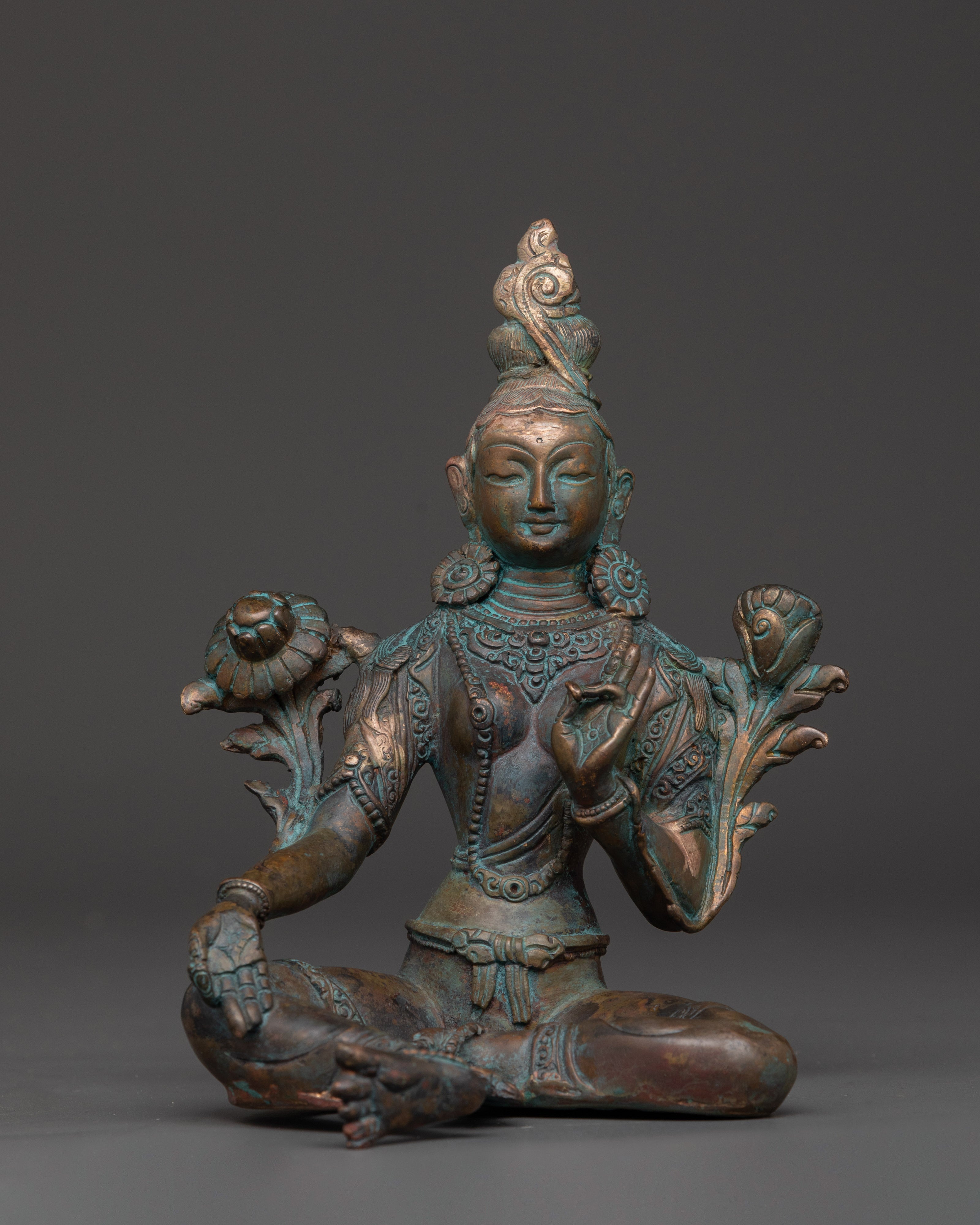 peaceful green tara statue
