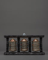 three-wheel-prayer-spinner-in-wooden-frame