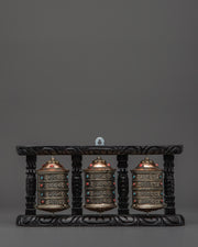 three-wheel-prayer-spinner-in-wooden-frame
