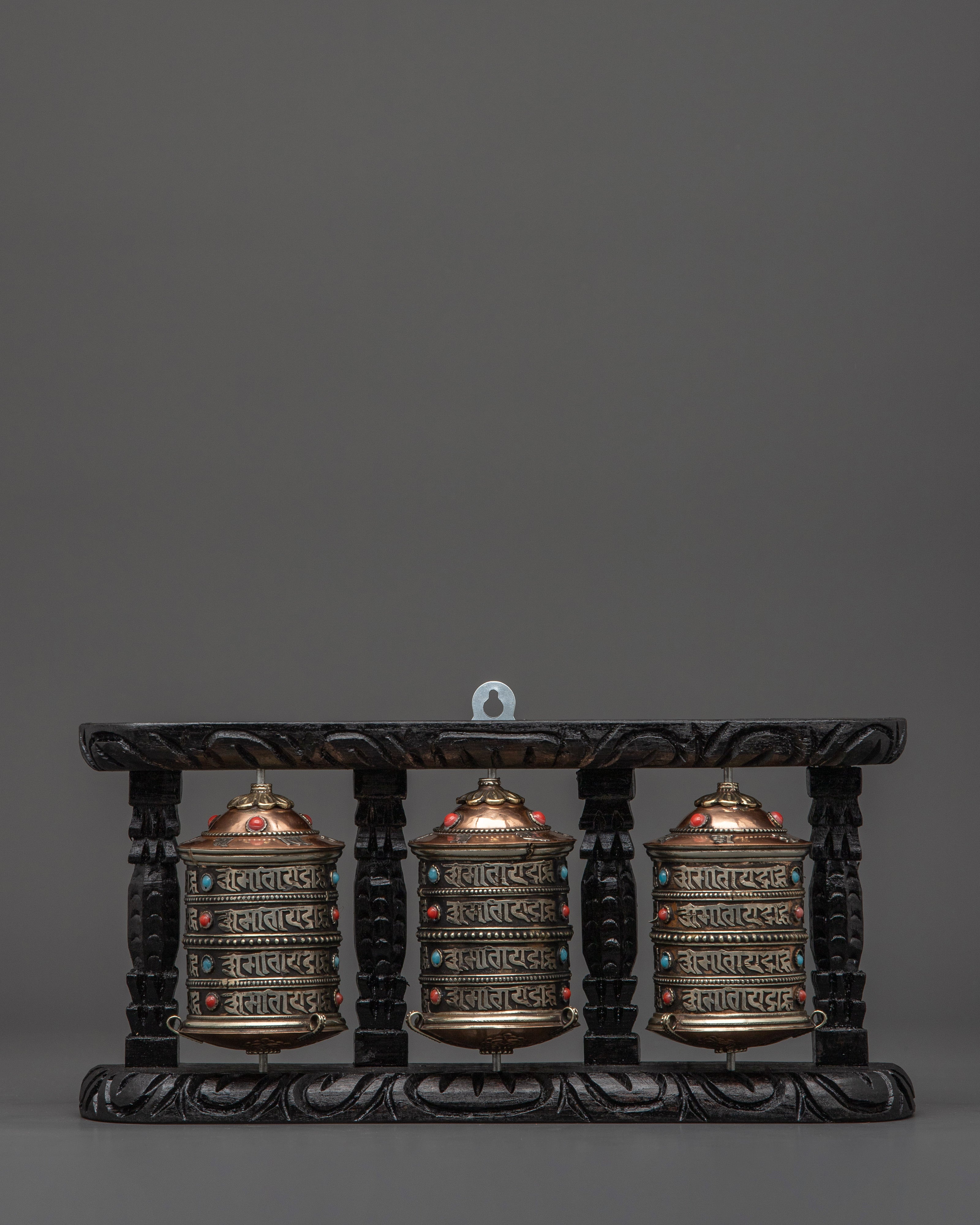 three-wheel-prayer-spinner-in-wooden-frame