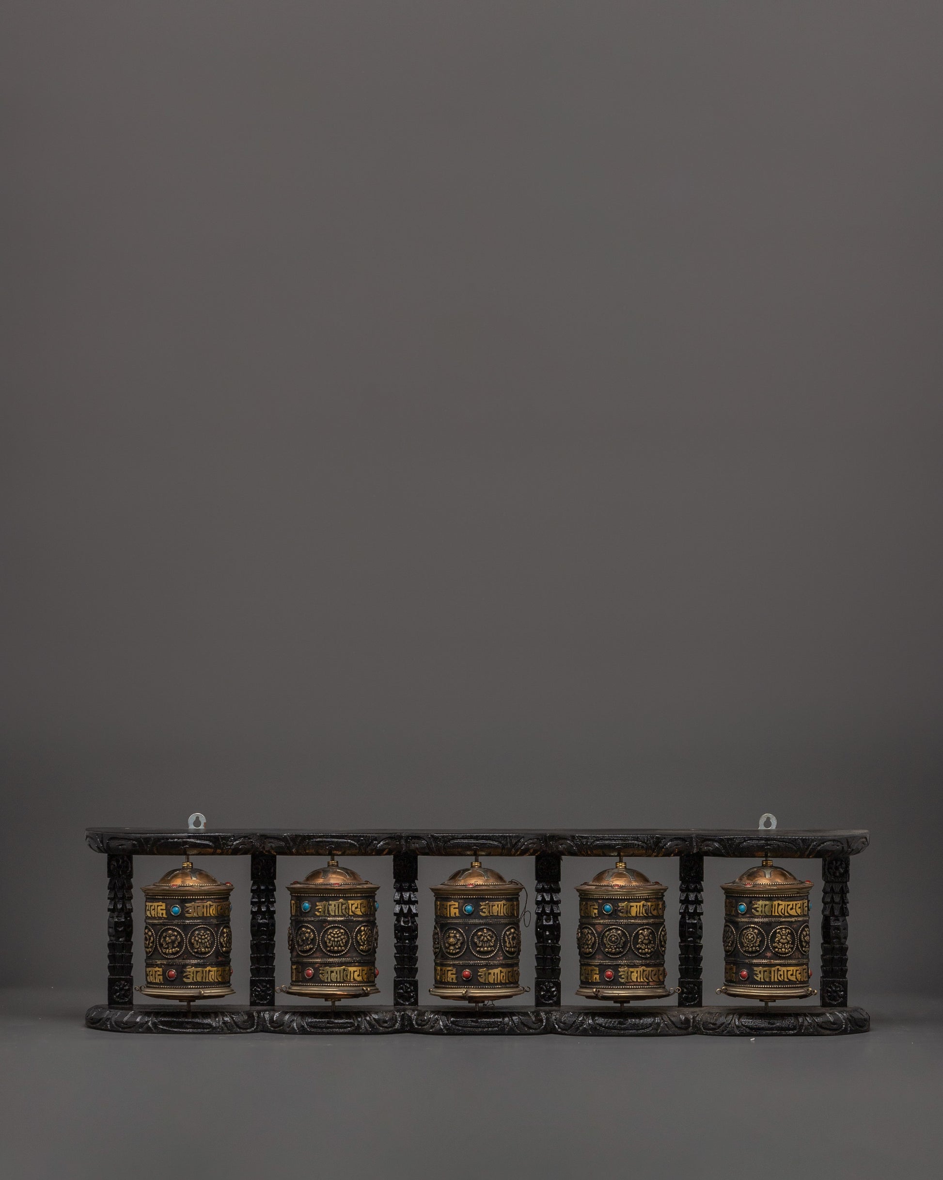Five Tibetan Prayer Wheels on a Wooden Frame