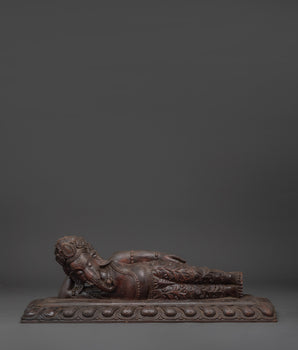 Reclining Ganesha sculpture